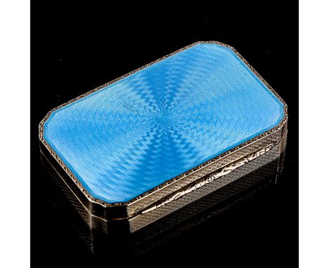 A lady's Art Deco silver and blue enamel vanity case, allover engine turned decoration with gilt interior, inset mirror, lips