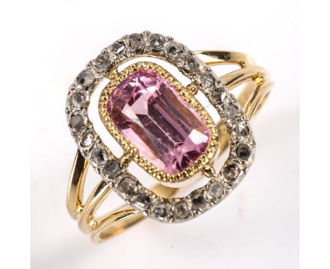 An early 20th century 18ct gold pink tourmaline and diamond cluster ring, openwork design with oval mixed cut tourmaline and 