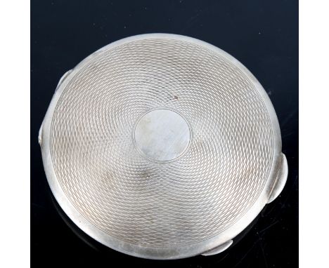 An Art Deco George VI circular silver compact, engine turned decoration, by Clark & Sewell, hallmarks Birmingham 1937, diamet