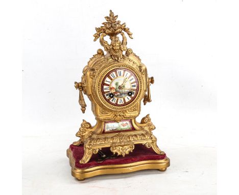 An early 20th century French gilt-metal 8-day mantel clock, hand painted watercolour dial with Roman numeral hour markers, or