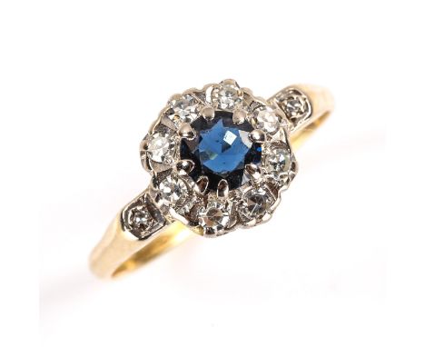 A late 20th century 18ct gold sapphire and diamond cluster ring, set with round cut sapphire and single cut diamonds, hallmar