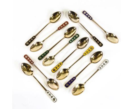 EGON LAURIDSEN - a set of 12 Danish vermeil sterling silver and harlequin enamel coffee spoons, with four leaf clover handles