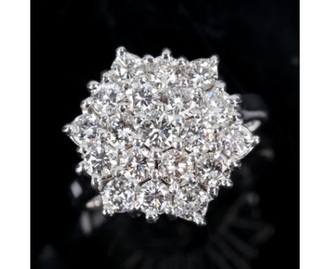 A modern 18ct white gold diamond cluster snowflake ring, set with modern round brilliant cut diamonds, total diamond content 