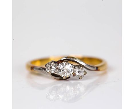 An early 20th century 18ct gold 3-stone diamond crossover ring, set with old European cut diamonds, total diamond content app