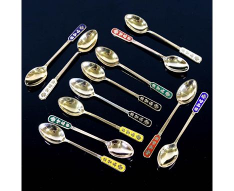 EGON LAURIDSEN - a set of 12 Danish vermeil sterling silver and harlequin enamel coffee spoons, with four leaf clover handles