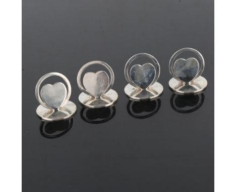 A set of 4 Edwardian silver 'Valentine' heart menu holders, by Miller Brothers, hallmarks Birmingham 1905, height 3cm, 2.5oz 