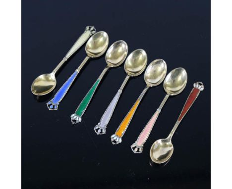 A set of 7 Scandinavian vermeil sterling silver and harlequin enamel coffee spoons, with crown terminals, spoon length 10cmOn