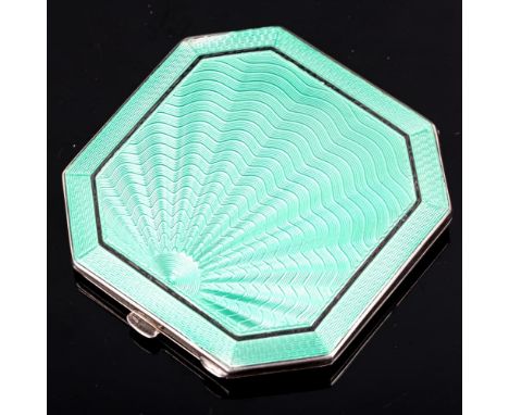 An Art Deco style George VI silver and green enamel compact, octagonal form with engine turned sunburst decoration, by Deakin