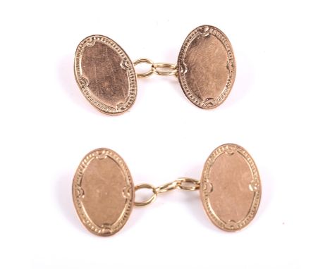 A pair of early 20th century 9ct rose gold oval panel cufflinks, engine turned decoration, hallmarks Chester 1924, panel leng