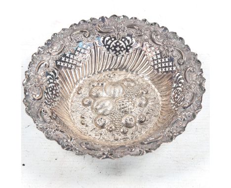 A late Victorian silver sweetmeat bowl, relief embossed fruit and foliate decoration with pierced and fluted gallery, by Fent