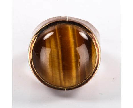 A large late 20th century 9ct gold tigers eye dress ring, set with round cabochon tigers eye, maker's marks S and B, hallmark