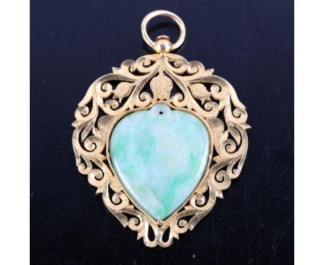 A Chinese high carat gold jade heart pendant, pierced and chased foliate decoration with central polished jade panel, tests a