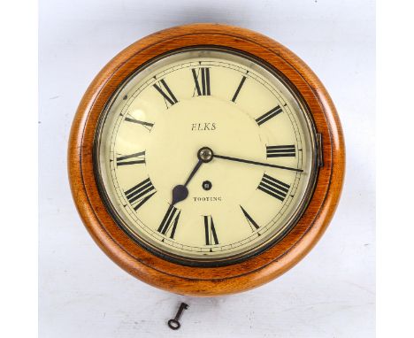 A light oak-cased 30-hour circular dial wall clock, by Elks of Tooting, cream dial with Roman numeral hour markers, blued ste