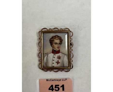A 19th century French portrait miniature of a young gentleman. Indistinctly signed. Mounted as a brooch. The gilt metal frame
