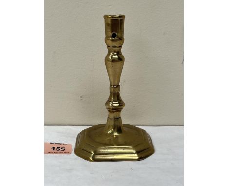 An 18th century brass candlestick with inverted baluster and knopped stem on octagonal stepped base. 6¾' high