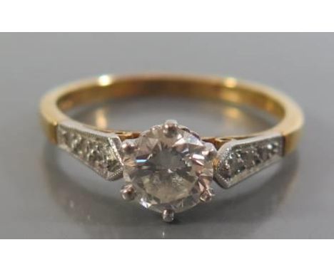 A Diamond Solitaire Engagement Ring in an 18ct yellow gold and platinum setting, size N, 3g (EDW .7ct) 