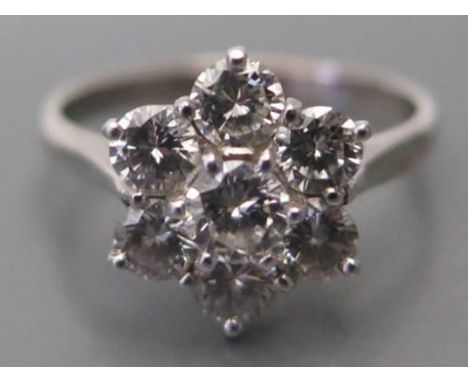 A Diamond Flower Head Cluster Ring in an 18ct white gold and platinum setting, size K.5, 3.4g (EDW .85ct) 