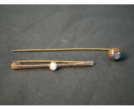 A yellow metal boulder opal stick pin, with carved and polished boulder opal ball to the end (good play of colour) along with