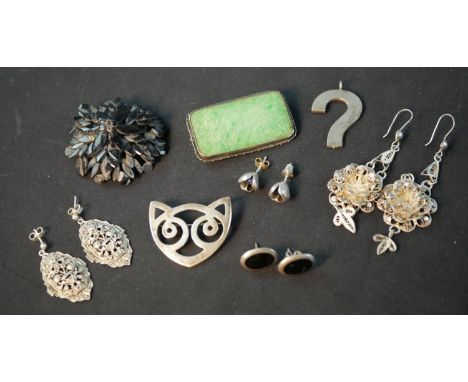 A collection of silver jewellery, including a animal face brooch (Hallmarked: RSE, London), a pair of silver tulip earrings s