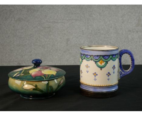 A Moorcroft green pottery circular bowl and cover in the African Lilly pattern along with an Art Deco Moorcroft hand painted 