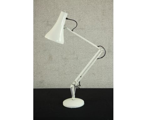 A mid 20th century Herbert Terry style anglepoise desk lamp, in white with a circular base. H.85 Dia.16cm. 