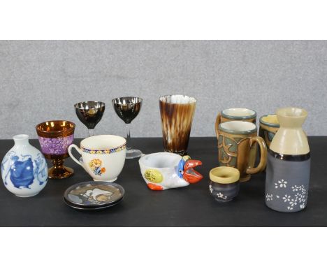 A collection of ceramics and glass, including pieces of Quimper china with tube lined designs, a 19th century lusterware gobl