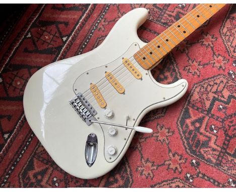 A 1970's CMI Lawsuit era copy of a Fender Stratocaster electric guitar in white with all original parts. Made at the Matsumot