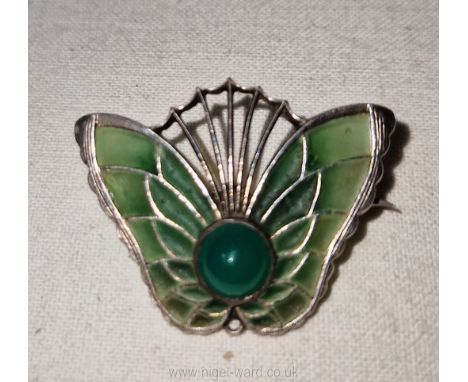 A splendid French art nouveau butterfly brooch circa 1900, translucent green plique-a-jour enamel set with a central caboucho