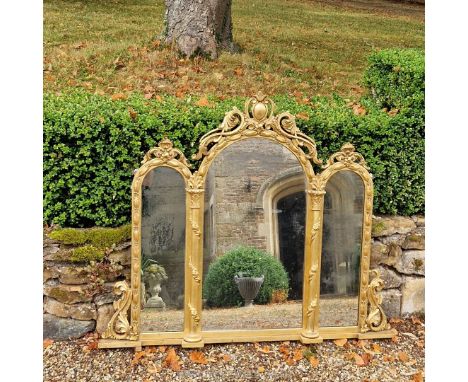 A large and impressive 19th century Venetian carved wood and gesso gilt triple plate mirror.