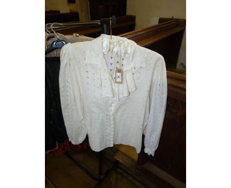 A lace blouse and a skirt both by Michele Domercq Paris.