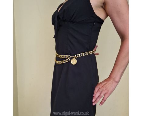 Chanel: a superb classic Belt in chain link gilt metal interwoven with black leather; medallion closure with portrait of Coco