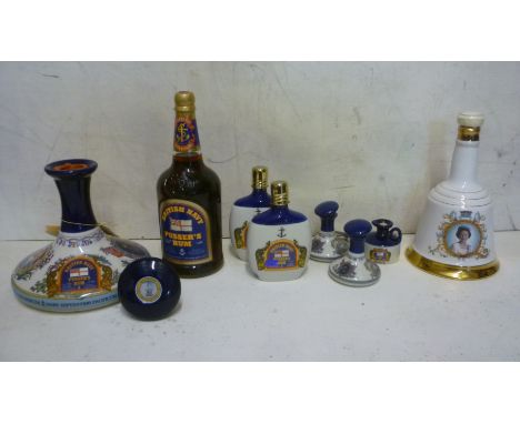 One litre Pusser's British Navy Rum, one litre Pusser's Rum in Wade pottery ship's decanter, two 200ml Pusser's Rum in cerami