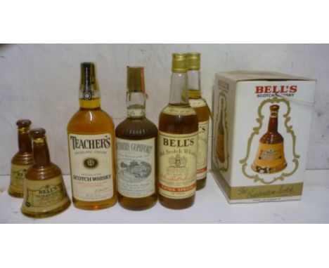 Two bottles Bells blended, one bottle Teacher's blended, one bottle Southern Comfort, one Wades decanter and two 6 2/3oz deca
