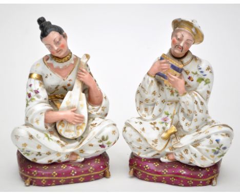 Pair of French figural scent bottles and stoppers in the form of Oriental musicians playing the mandolin and pipe, both sitti