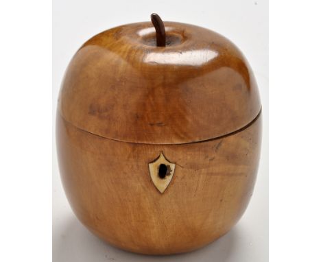 An apple pattern fruitwood tea caddy, with shield-shaped escutcheon, 5in. (12cms) high.