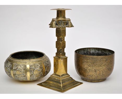 Brass cruciform-shaped candlestick, probably Indian, with part 'block and octagonal' column, height 29cm; two brass bowls, th