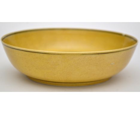 Chinese yellow glaze 'Dragon' bowl, the interior central roundel with writhing dragon chasing flaming pearl, enclosed by dark