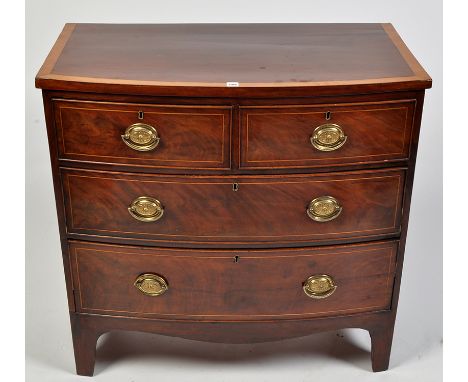 A George III mahogany bowfront chest of two short and two long graduated drawers fitted later brass handles, with satinwood c