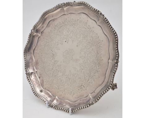 A Victorian waiter, by Henry Wilkinson & Co., London 1867, shaped circular, with beaded raised border, engraved crest within 