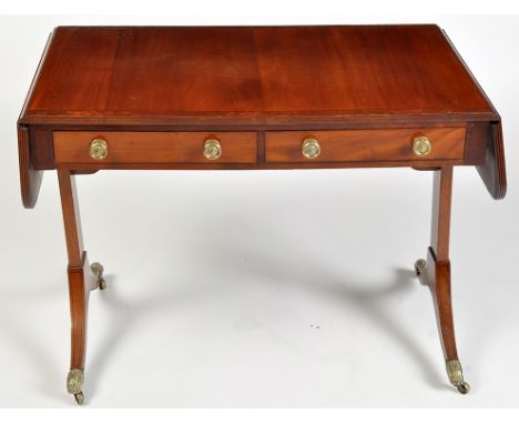 A George III mahogany sofa table, the rectangular top and fall-flaps with ebony stringing and reeded edge, above two frieze d