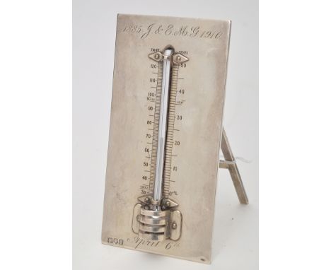 An Edwardian silver easel back presentation thermometer, by Alfred James Blake, London 1909, with presentation inscription, 1