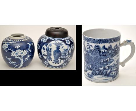 Two Chinese blue and white ginger jars, blue grounds with prunus blossom and reserve panels to the larger, the larger with un