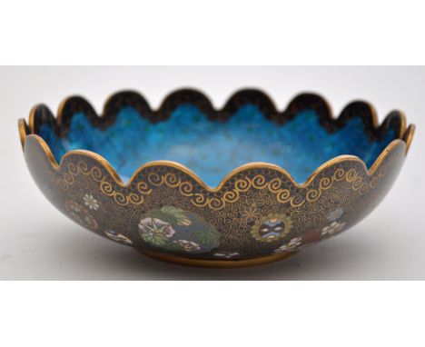 A Chinese cloisonne lobed bowl, the interior with translucent enamel upon pale blue ground, the exterior with floral and inse