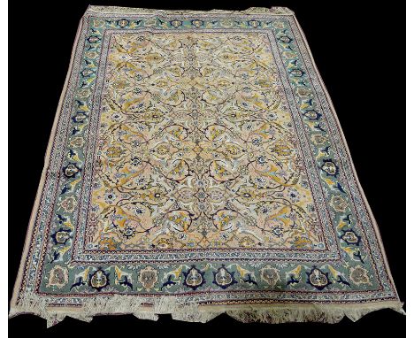 A Tabriz carpet, the light coloured ground with scrolling floral design, 285 x 196cms (112 x 77in.).