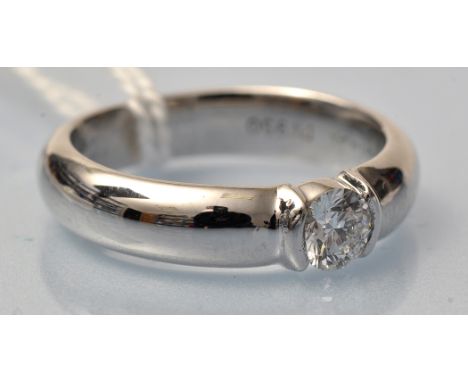 A Tiffany solitaire diamond ring, the brilliant cut diamond weighing 0.29 carats, the platinum ring stamped '054474', ring si