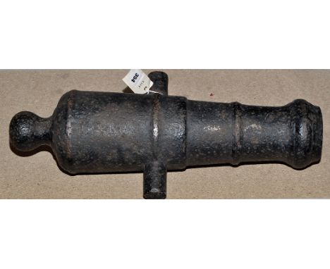 A cast iron black painted deck cannon, 50cms (19 1/2in.) long.