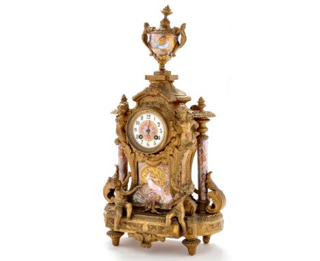 A late 19th Century Louis XVI style giltmetal mantel clock, the 3in. dial with arabic numerals, on white porcelain ground, th