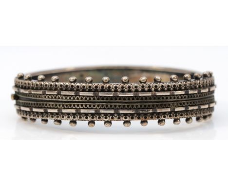 A Victorian silver hinged bangle, Birmingham 1890, 57 x 48 x 11mm, 22gm