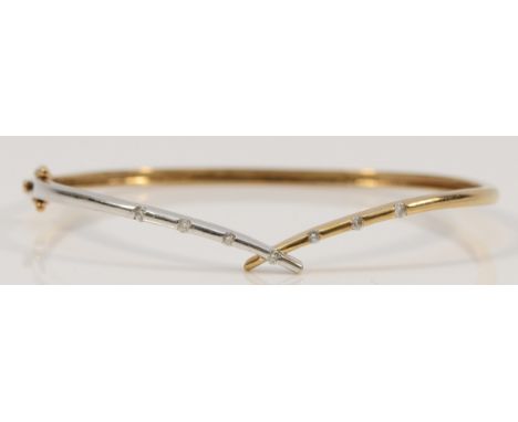 A 9ct gold diamond hinged bangle, 58mm inner, 6.7g