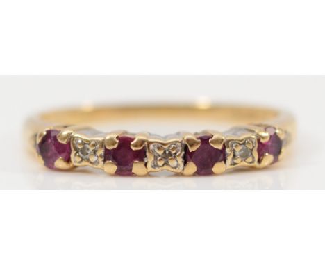 A 9ct gold ruby and diamond half eternity ring, K, 1.6g
